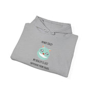 Graphic Hoodie — "I’m Not Crazy, My Reality Is Just Different From Yours" Wonderland Hooded Sweatshirt