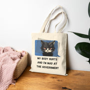 Tote Bag — "My Body Hurts and I’m Mad at the Government" Sassy Cat Canvas Tote
