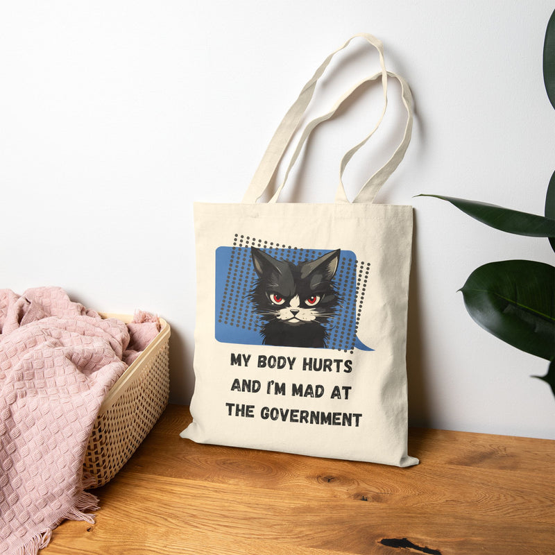 Graphic Reusable Tote Bag — "My Body Hurts and I’m Mad at the Government" Sassy Cat Canvas Tote