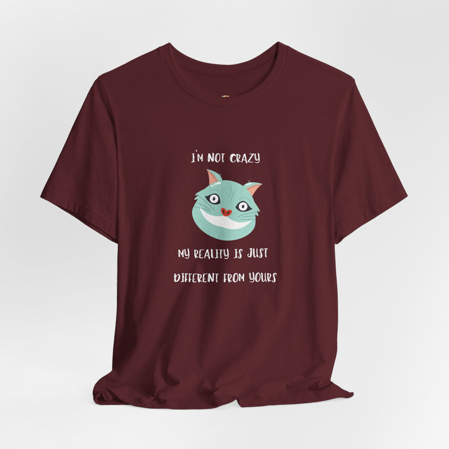 Graphic Tee — “I’m Not Crazy, My Reality Is Just Different From Yours” Wonderland T‑Shirt