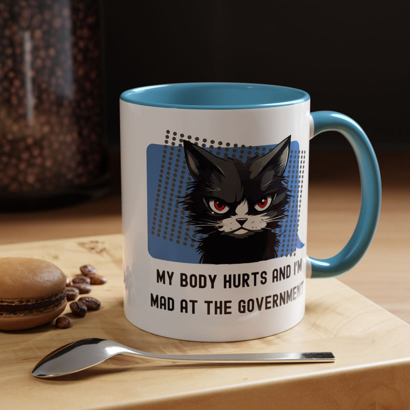 11 oz Coffee and Tea Mug — "My Body Hurts and I'm Mad at the Government" Sassy Cat Accent Mug