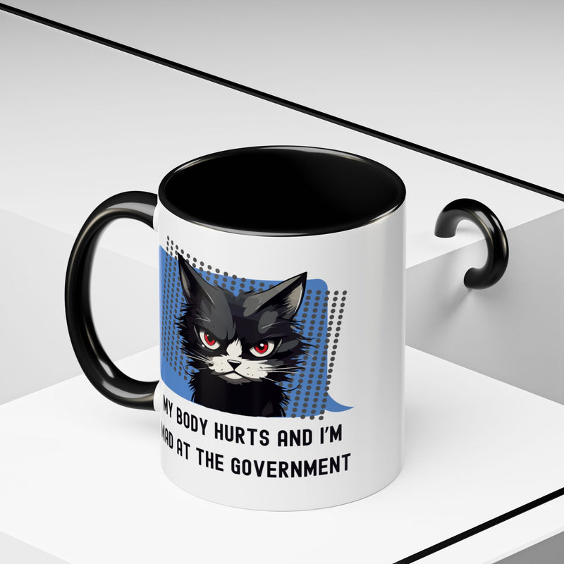 11 oz Coffee and Tea Mug — "My Body Hurts and I'm Mad at the Government" Sassy Cat Accent Mug