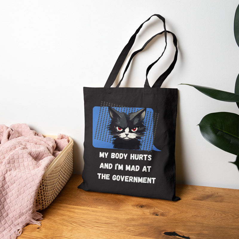 Graphic Reusable Tote Bag — "My Body Hurts and I’m Mad at the Government" Sassy Cat Canvas Tote