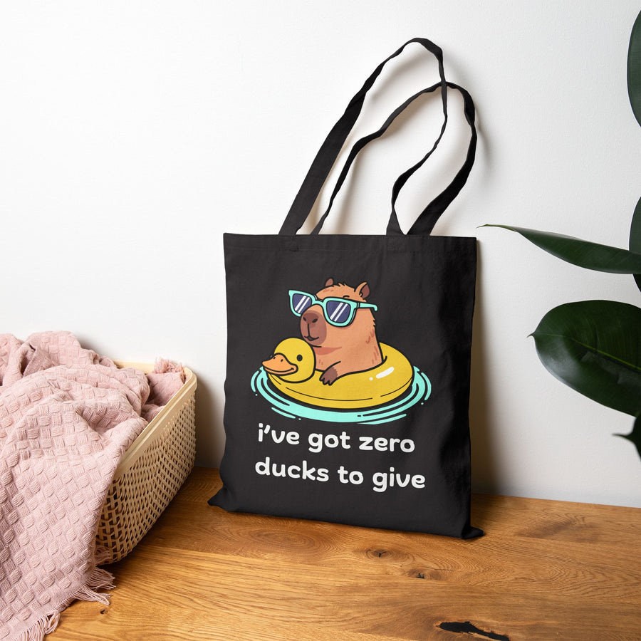 Canvas Tote Bag —Capybara Float with Rubber Duck “I’ve Got Zero Ducks to Give”
