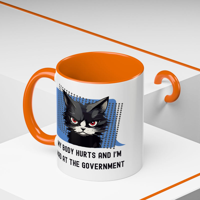 11 oz Coffee and Tea Mug — "My Body Hurts and I'm Mad at the Government" Sassy Cat Accent Mug