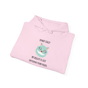 Graphic Hoodie — "I’m Not Crazy, My Reality Is Just Different From Yours" Wonderland Hooded Sweatshirt