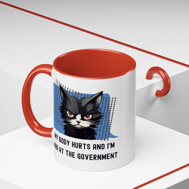 11 oz Coffee and Tea Mug — "My Body Hurts and I'm Mad at the Government" Sassy Cat Accent Mug