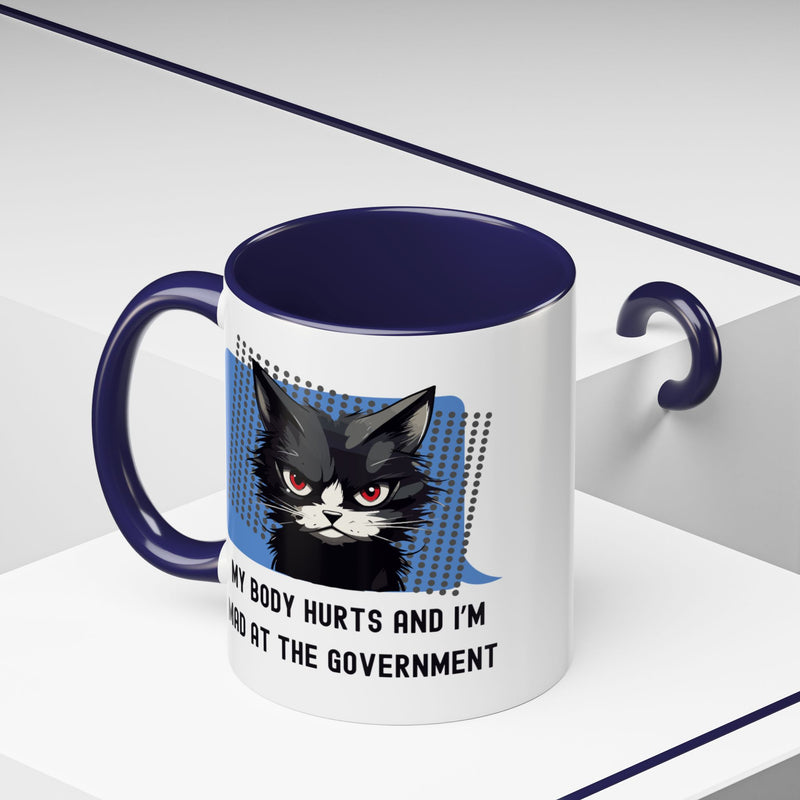 11 oz Coffee and Tea Mug — "My Body Hurts and I'm Mad at the Government" Sassy Cat Accent Mug