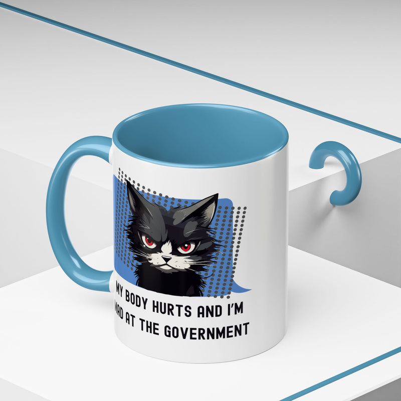 11 oz Coffee and Tea Mug — "My Body Hurts and I'm Mad at the Government" Sassy Cat Accent Mug