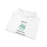 Graphic Hoodie — "I’m Not Crazy, My Reality Is Just Different From Yours" Wonderland Hooded Sweatshirt