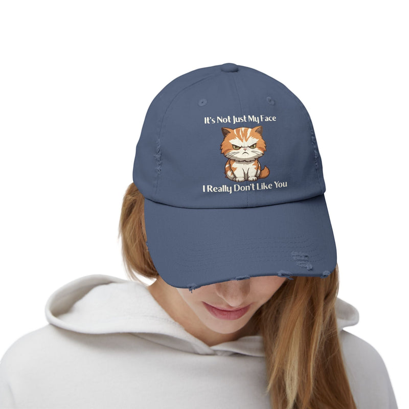 Ironically Inked blue distressed cotton twill cap featuring a grumpy orange kitten graphic and cheeky text.