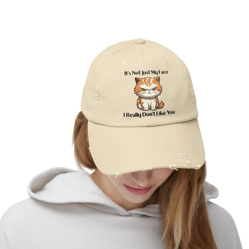 Ironically Inked distressed beige cotton cap featuring a grumpy orange kitten graphic and cheeky text on the front.