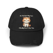 Ironically Inked black distressed cotton twill cap featuring a grumpy orange kitten graphic and funny text.