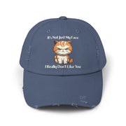 Ironically Inked blue distressed cotton twill cap featuring a grumpy orange kitten graphic and funny text.