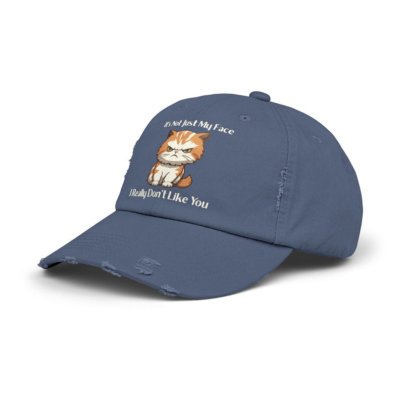 Ironically Inked distressed blue cotton twill cap featuring a grumpy orange kitten graphic and cheeky text.