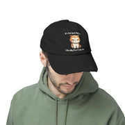 Ironically Inked black distressed cotton cap featuring a grumpy orange kitten graphic and funny text on a model