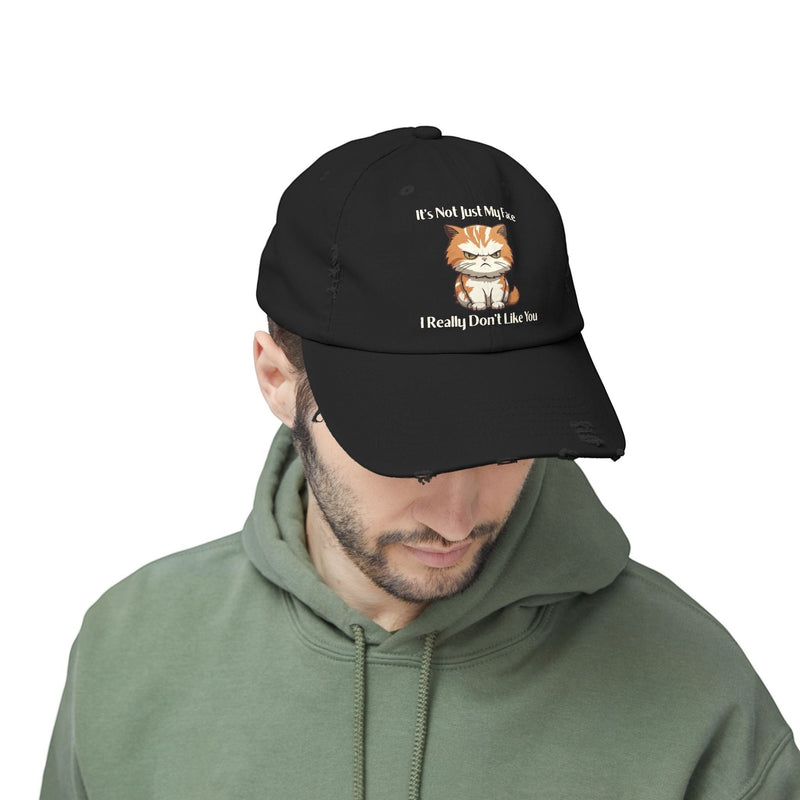 Ironically Inked black distressed cotton cap featuring a grumpy orange kitten graphic and funny text on a model