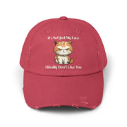 Ironically Inked distressed red cotton twill cap featuring a grumpy orange kitten graphic and cheeky text.