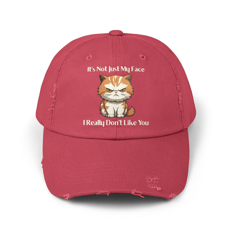 Ironically Inked distressed red cotton twill cap featuring a grumpy orange kitten graphic and cheeky text.