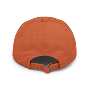 Ironically Inked orange distressed cotton twill cap, back view showing adjustable hideaway strap with metal D-ring.