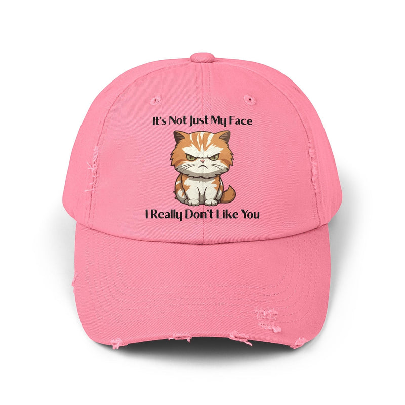 Ironically Inked pink distressed cotton twill cap featuring a grumpy orange kitten and cheeky text graphic.