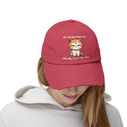 Ironically Inked red distressed cotton twill cap featuring a grumpy orange kitten graphic and cheeky text.